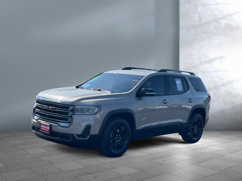 2022 GMC Acadia AT4 in Light Stone Metallic — front three-quarter view