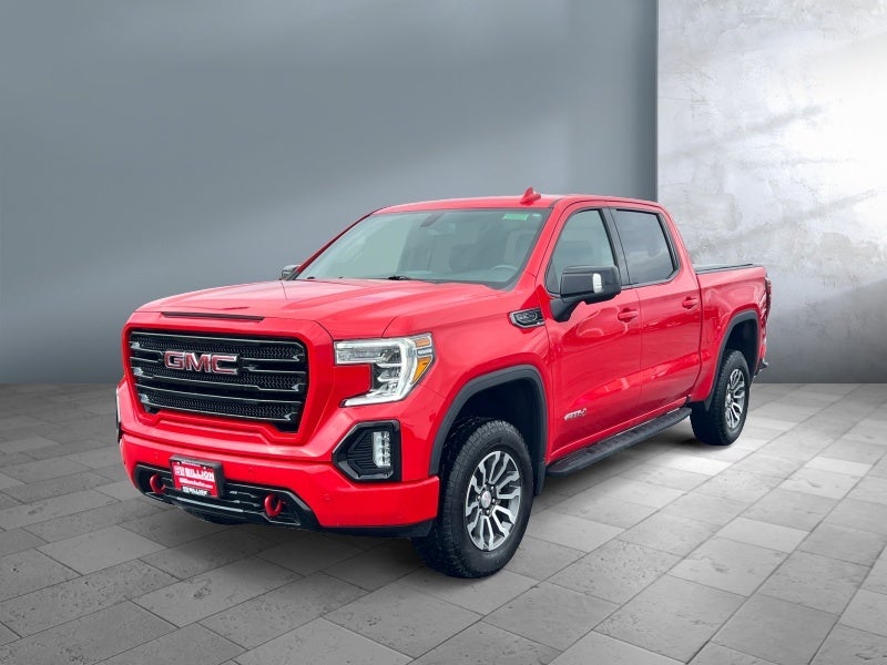 2021 GMC Sierra 1500 AT4 in Cardinal Red — front three-quarter view