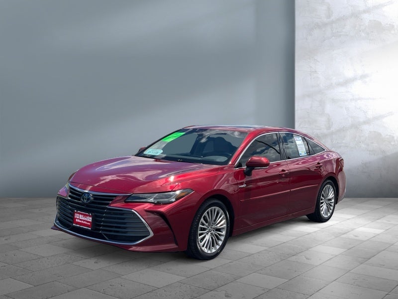 2020 Toyota Avalon Hybrid Limited in Ruby Flare Pearl — front three-quarter view