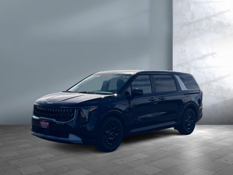 2026 Kia Carnival LX in Blue — front three-quarter view